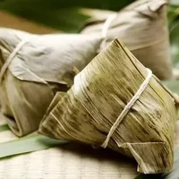 包粽子叶是用什么叶子？我国很早就出现用芦苇叶包粽子的习俗